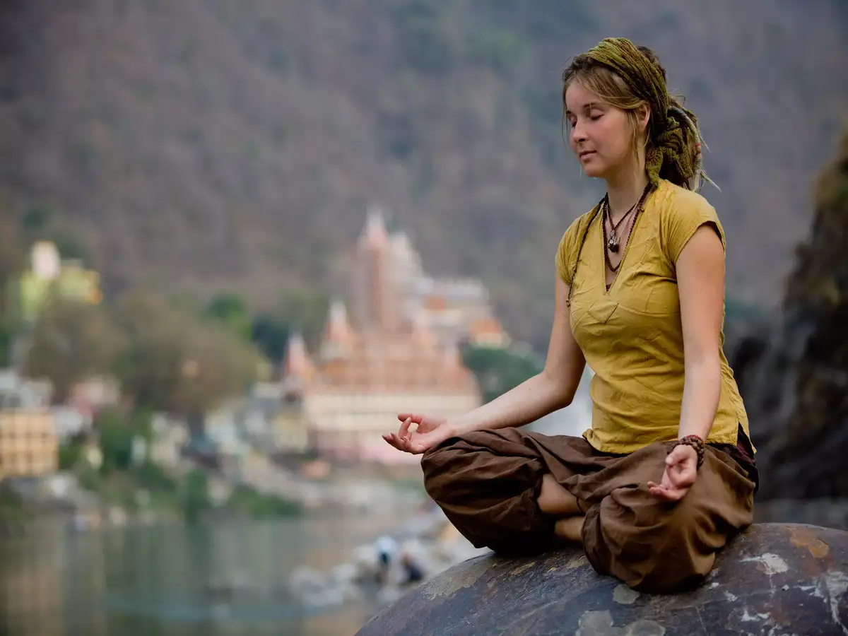 woman performing yoga in Rishikesh