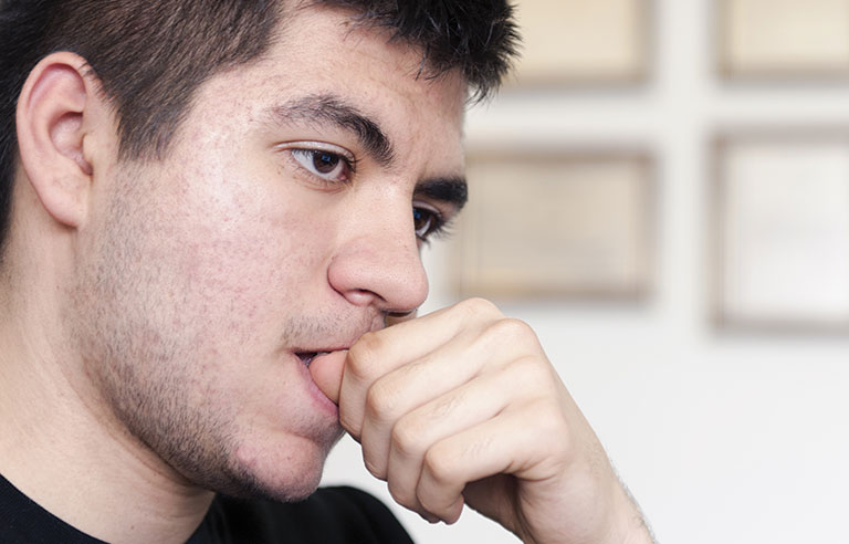 What could be the reason behind biting your nails