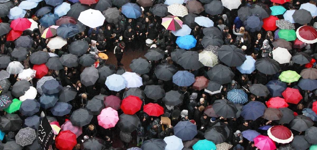 people using black umbrellas