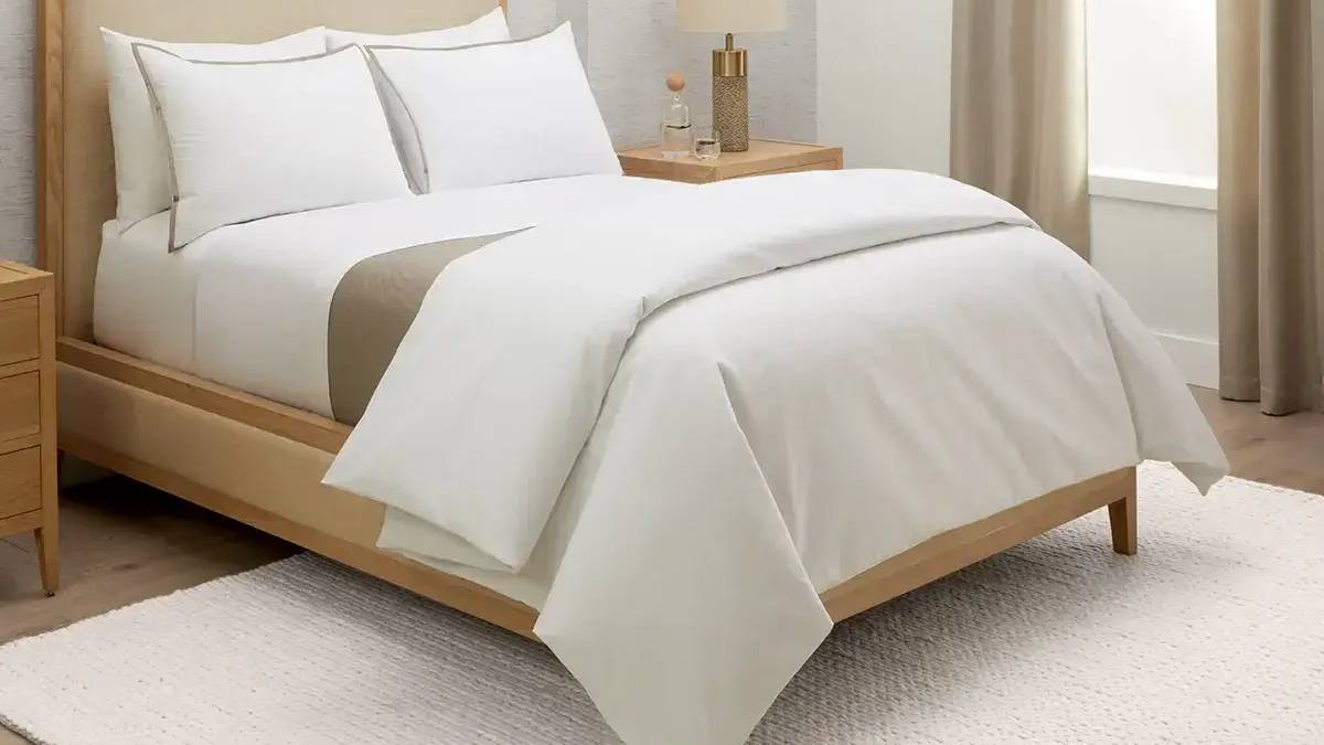 white bedsheet in hotel room
