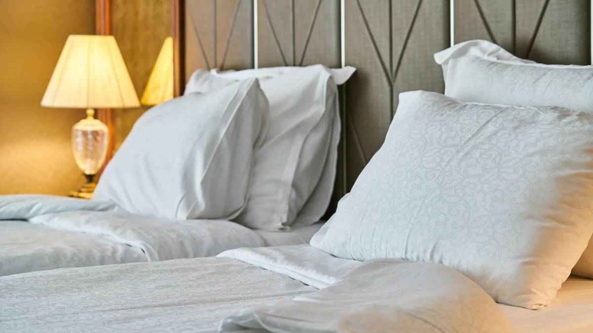 white bedsheet in hotel room