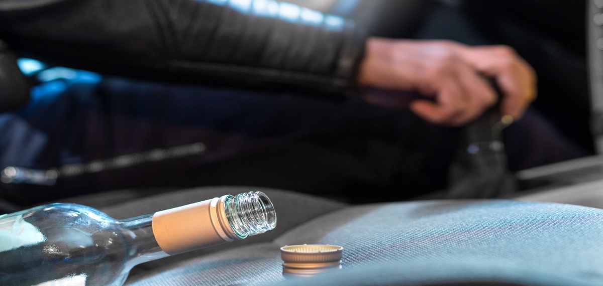 fine consume alcohol while sitting in a car