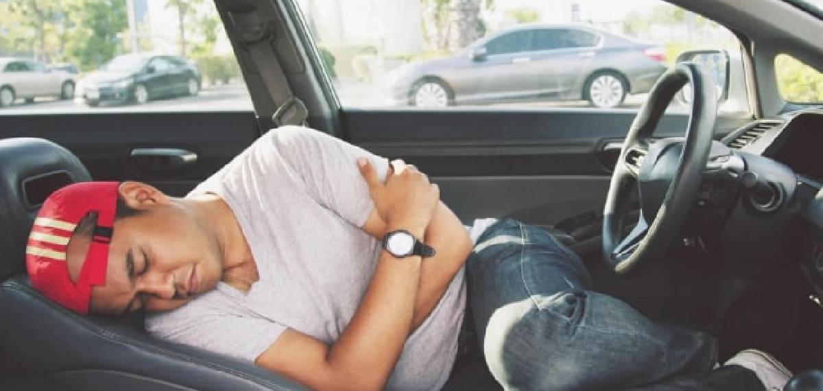 sleeping in a car parked by the roadside