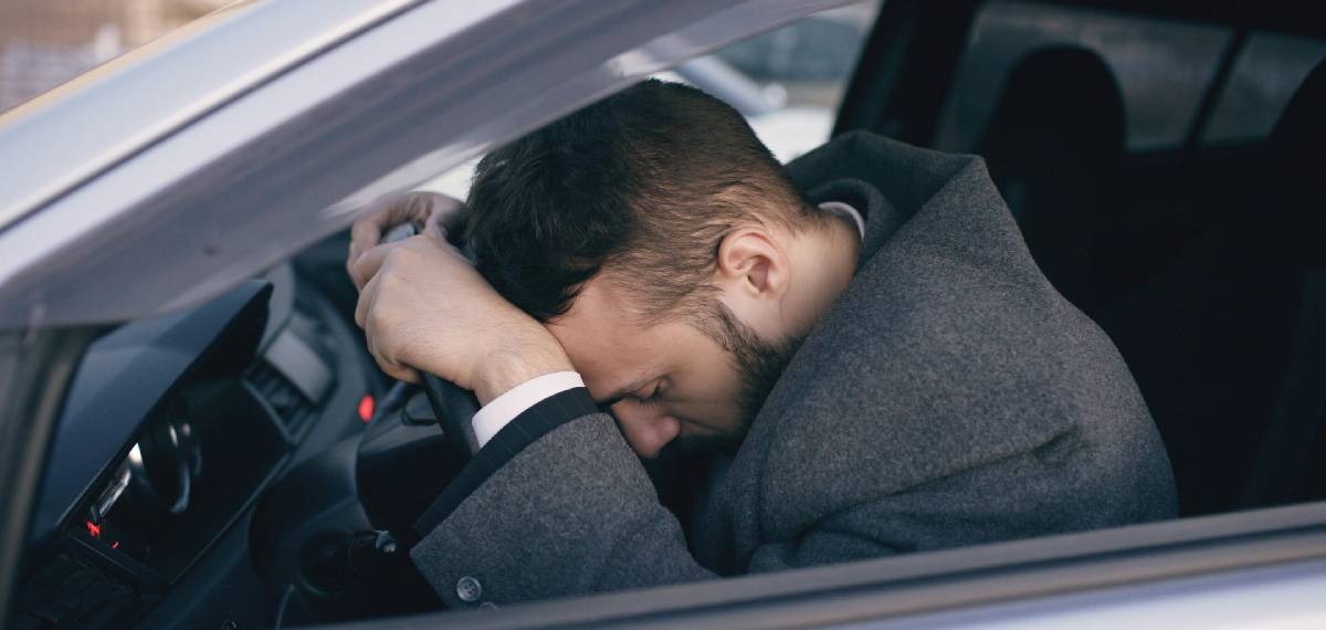 sleeping in a car parked by the roadside