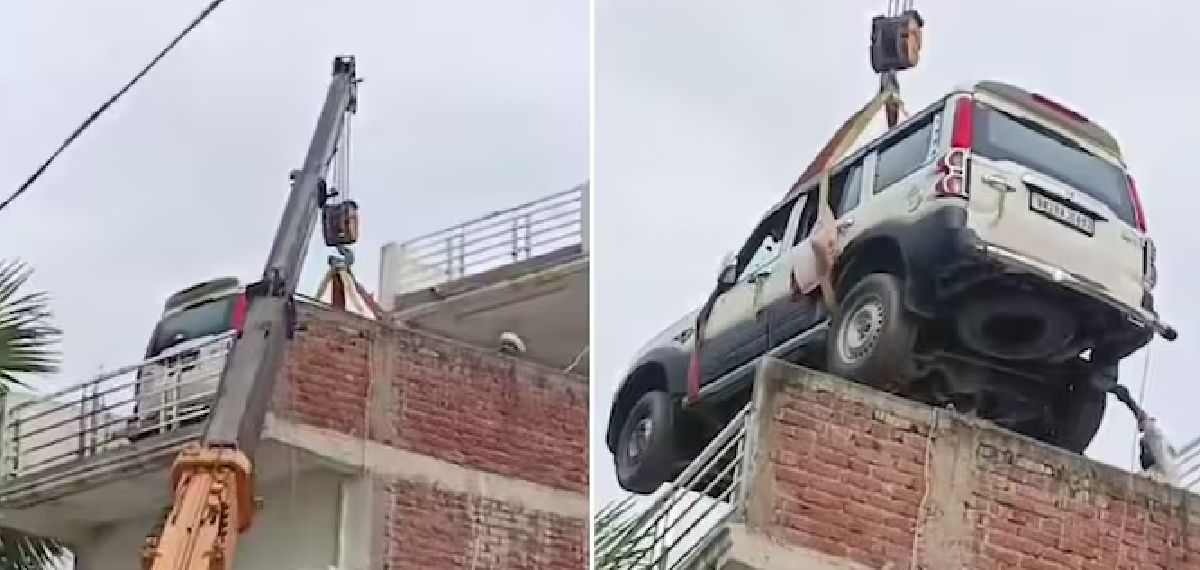 മോഷണം ഭയന്ന് ഉടമയുടെ വിചിത്ര നടപടി; ക്രെയ്ൻ ഉപയോഗിച്ച് കാർ വീട്ടിന്റെ മുകളിലേക്ക് മാറ്റി
