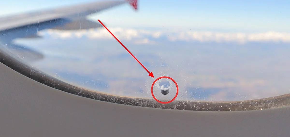 small hole in the airplane windows