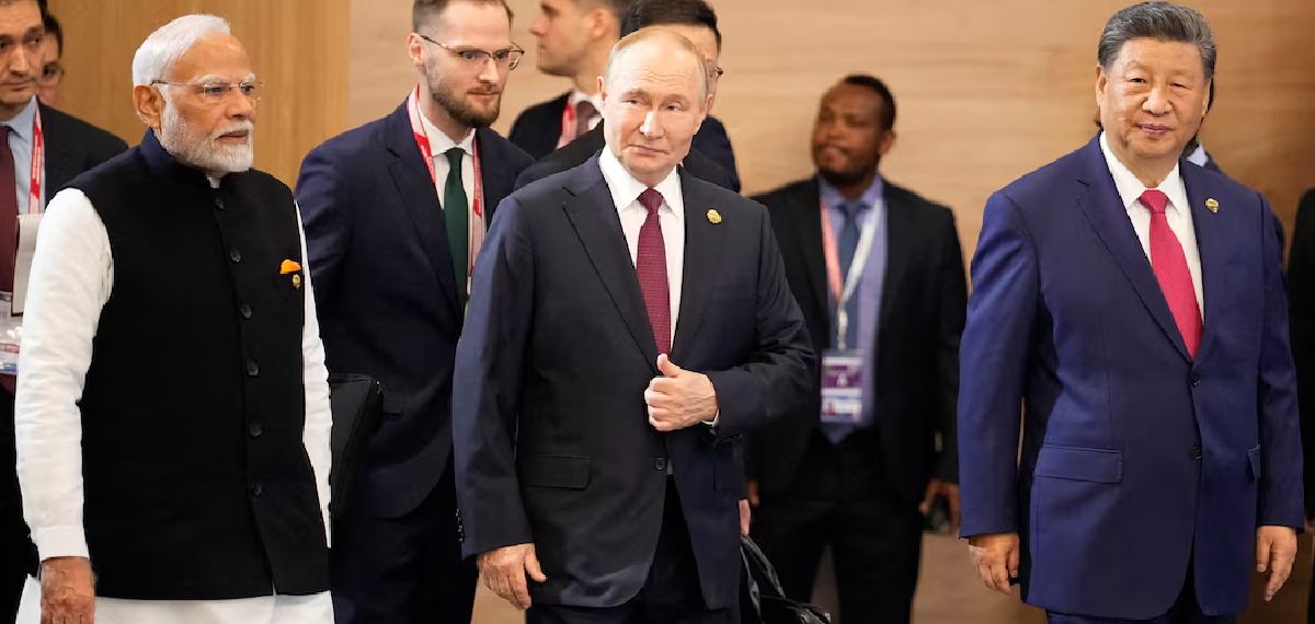 Indian Prime Minister Narendra Modi, Russian President Vladimir Putin and Chinese President Xi Jinping attend a family photo ceremony prior to the BRICS Summit plenary session in Kazan, Russia, Wednesday, October 23, 2024.