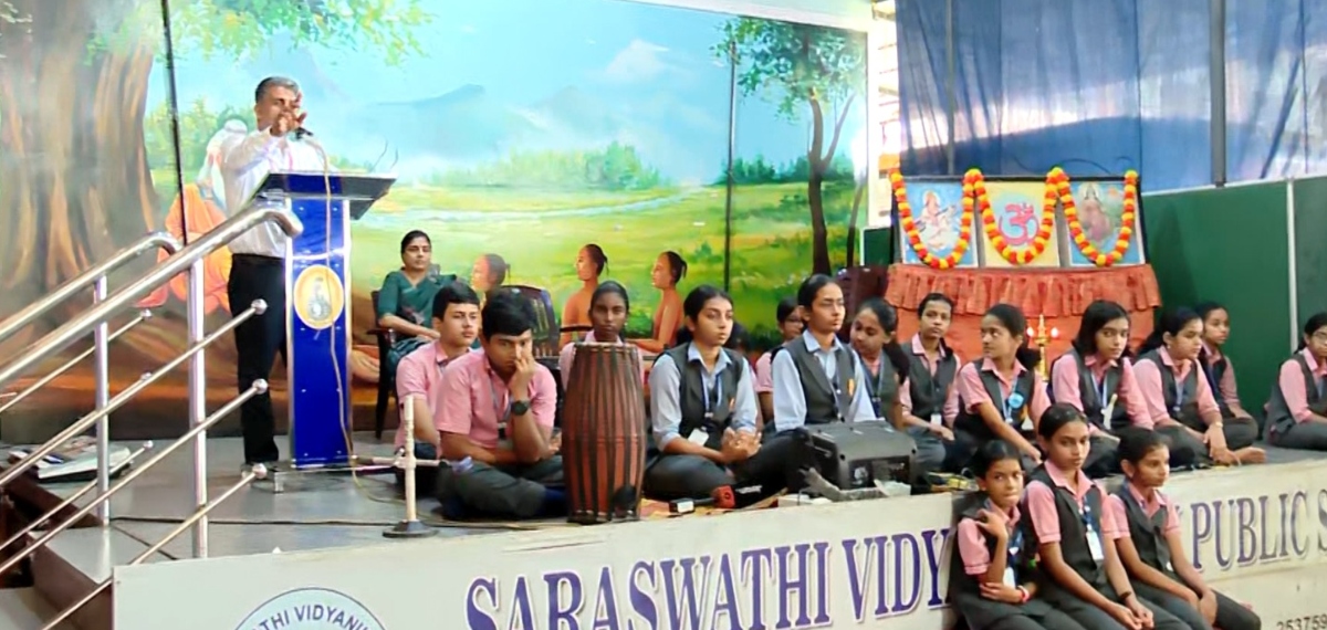 School Principal K P Dinto speaks to students