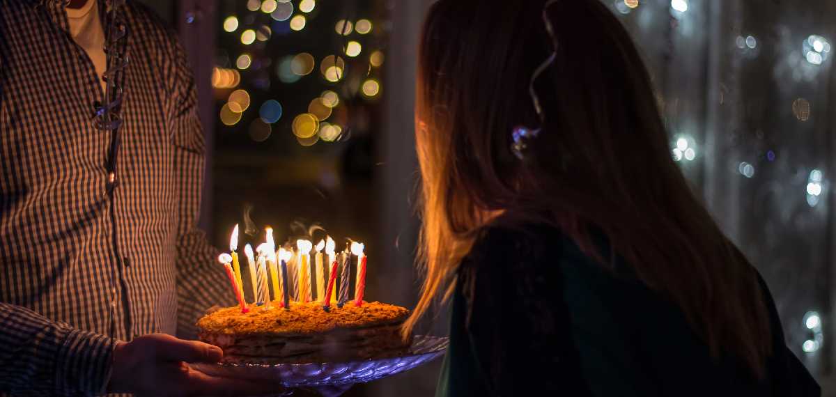 blow out the candles cutting a birthday cake